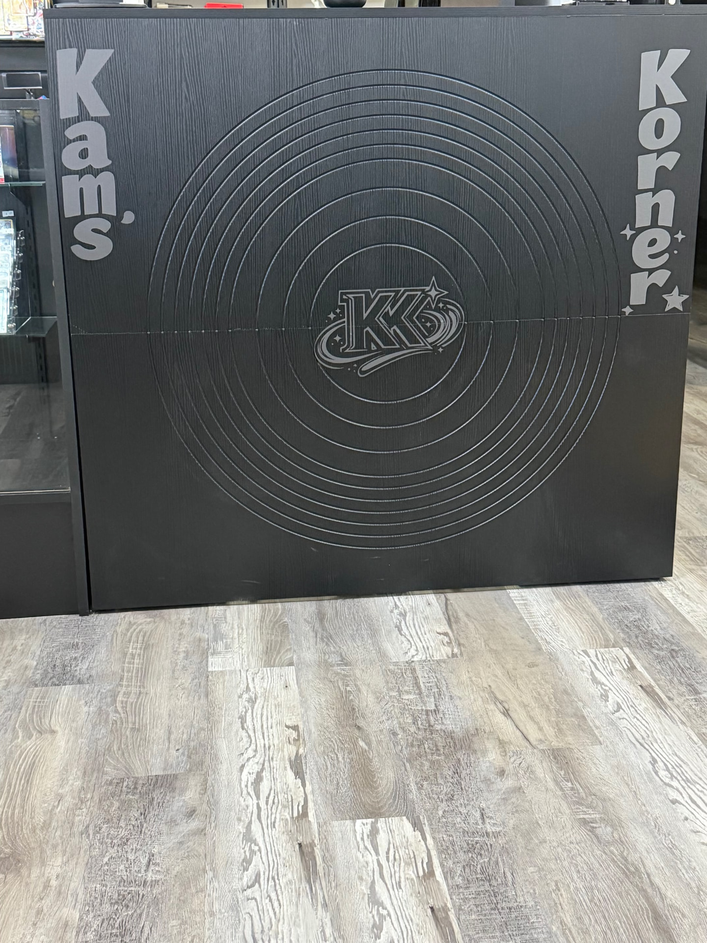 The Kam's Korner front counter with the shop logo